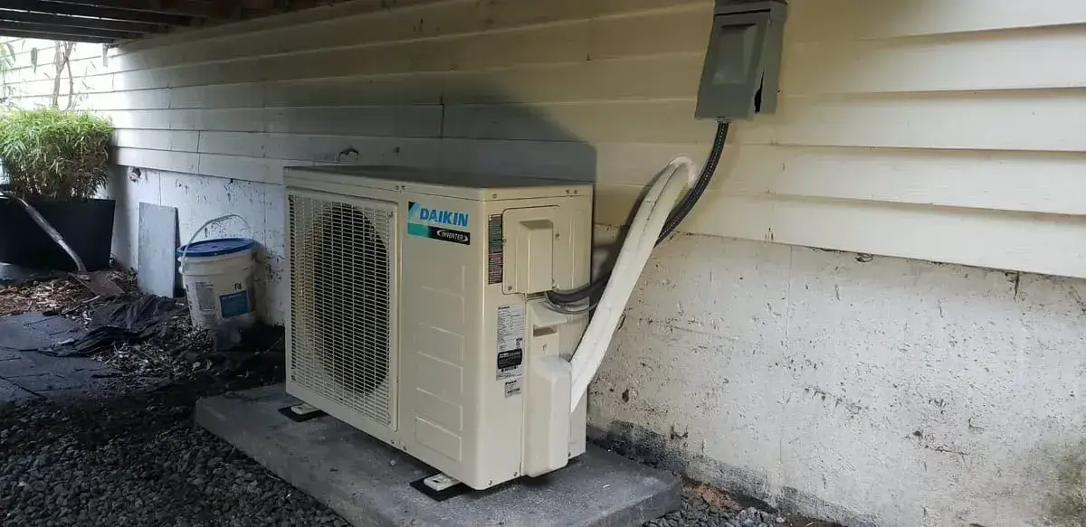 Daikin ductless mini-split outdoor unit on a concrete pad