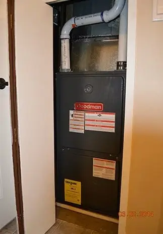 Gas furnace installed in a utility closet
