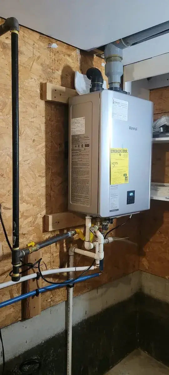 Wall-mounted tankless water heater with new gas and water lines