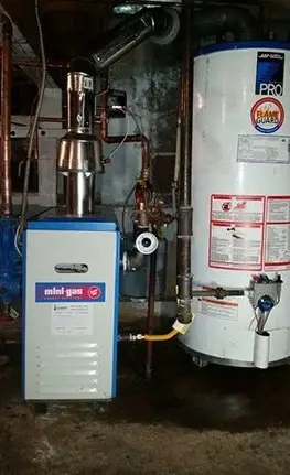 Gas boiler and hot water tank installation
